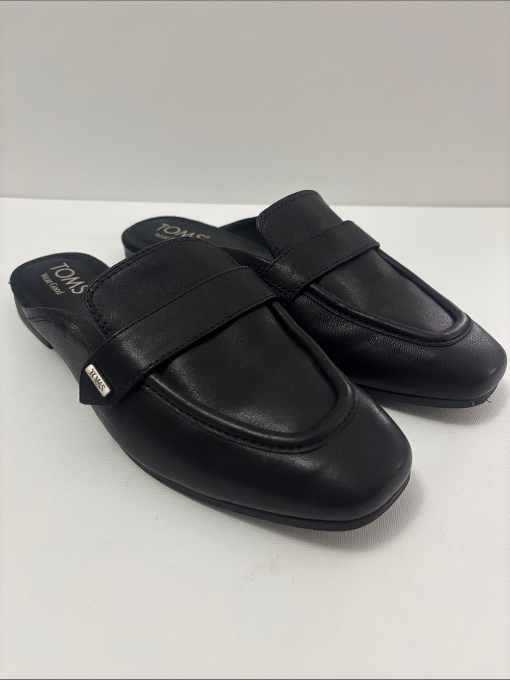 Never worn- Toms Black Leather Slip-On Mule Loafers